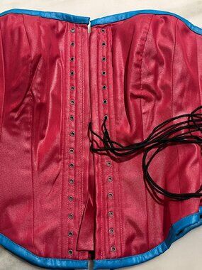 Full lacing over bust corset, magenta with blue/teal trim